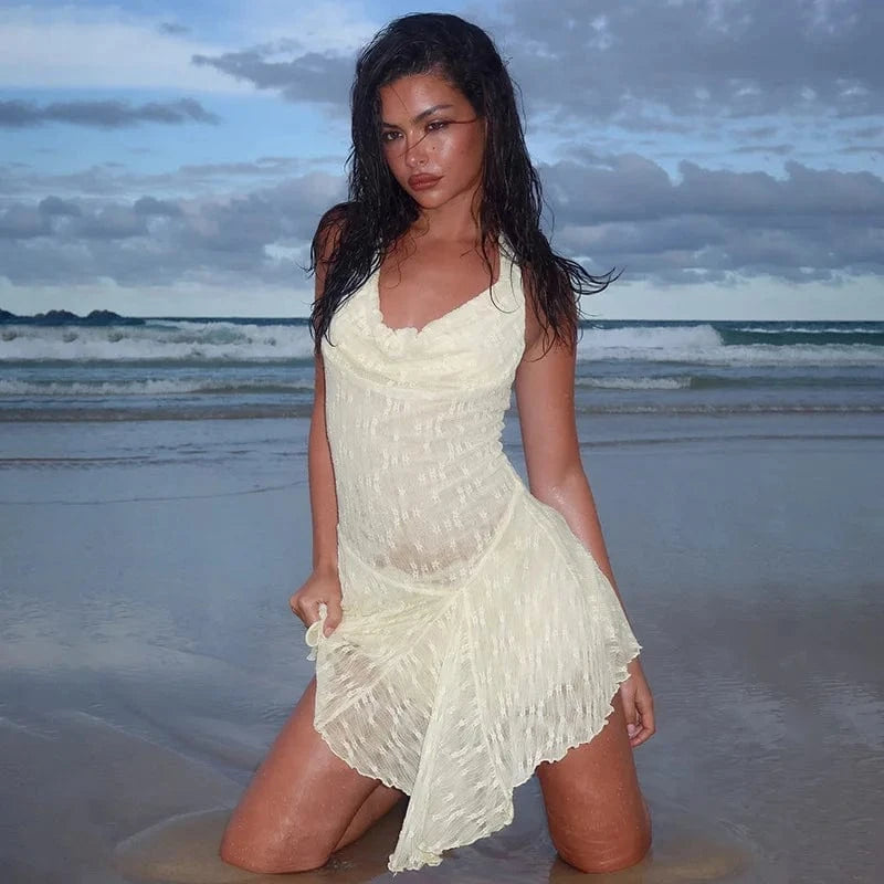 Robe plage évasée blanche courte sans manches fluide décolleté été légère style vacances bord de mer