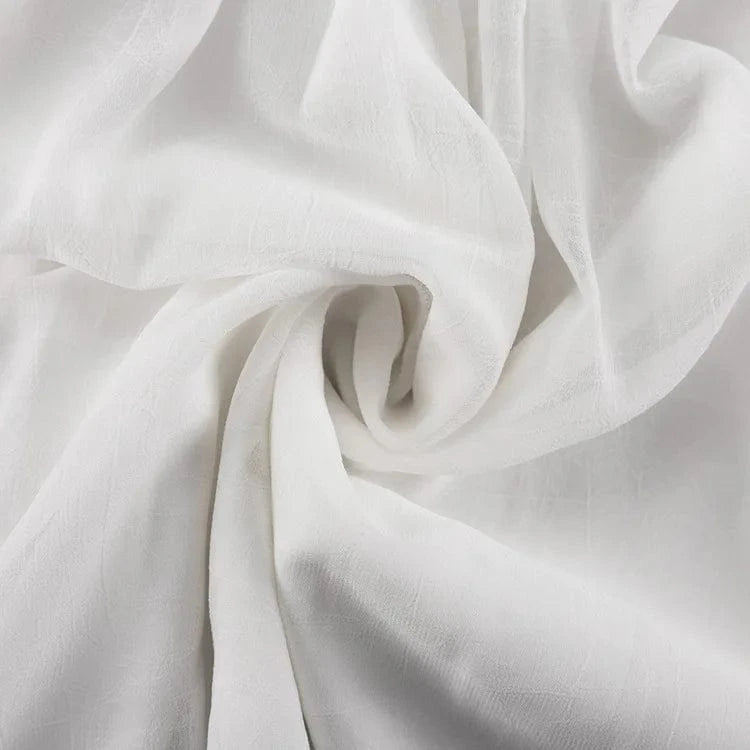 Robe blanche été bohème fluide femme en gaze de coton matière légère idéale plage ou mariage invitee