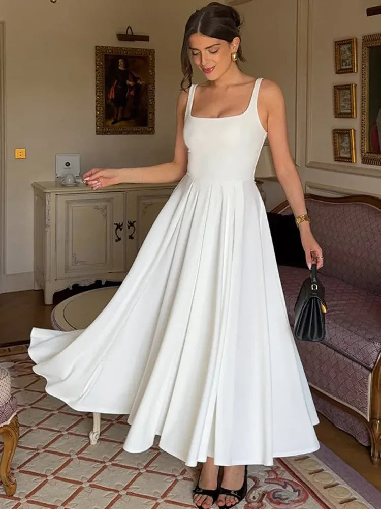 Robe de cocktail midi fluide à bretelles