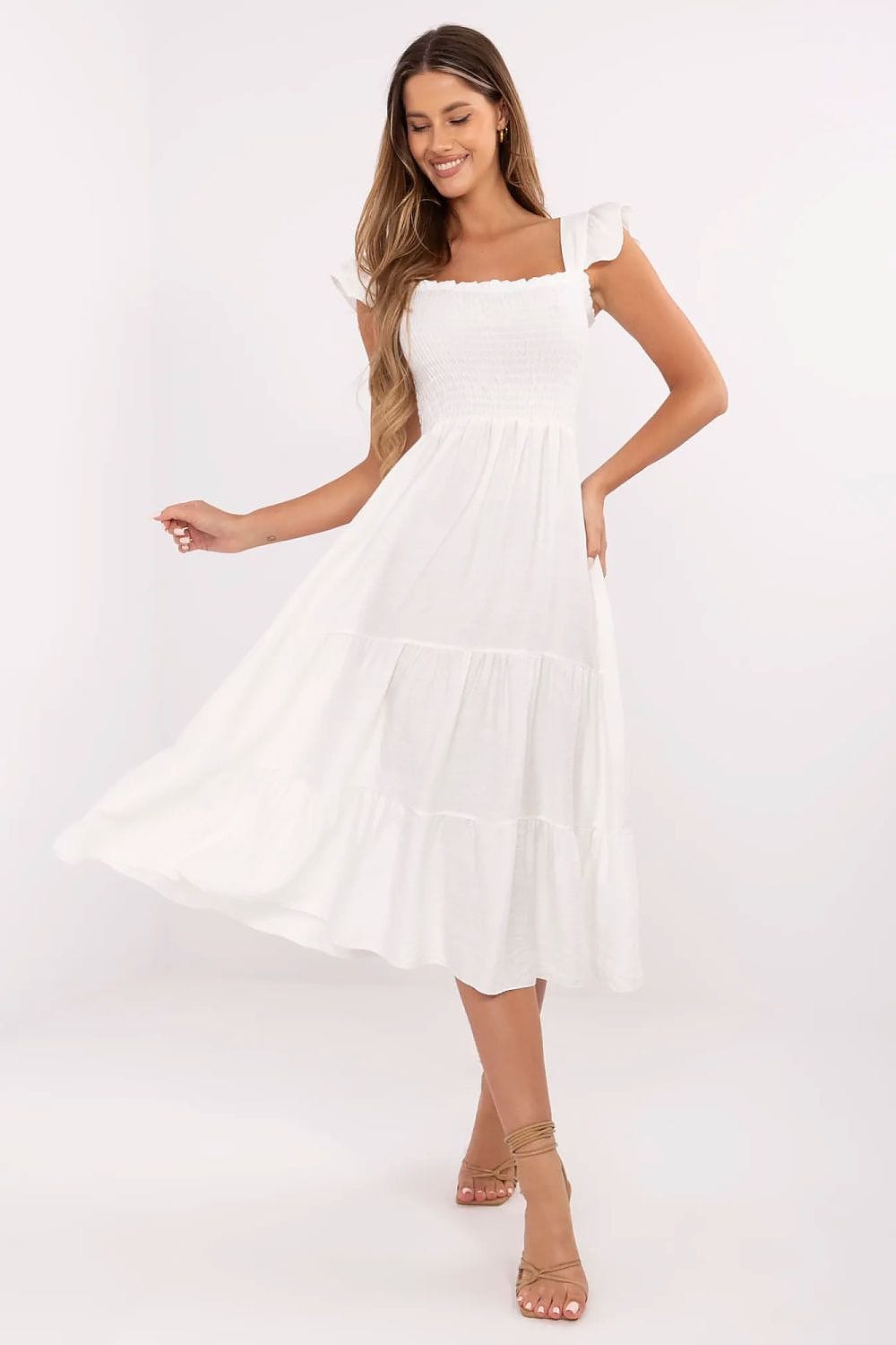 Robe été bohème blanche midi évasée sans manches idéale pour plage ou mariage invité, style chic et fluide