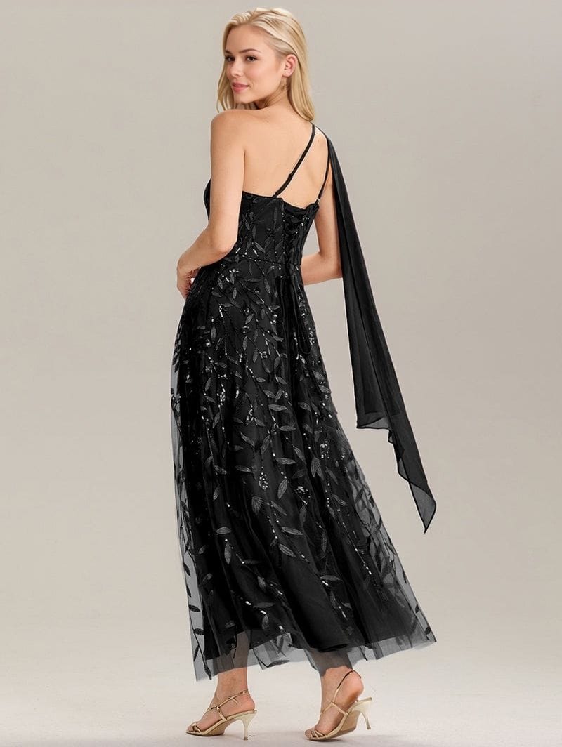 Robe de soirée chic noire longue dos nu élégante avec tulle et sequins pour invitée mariage ou événement gala