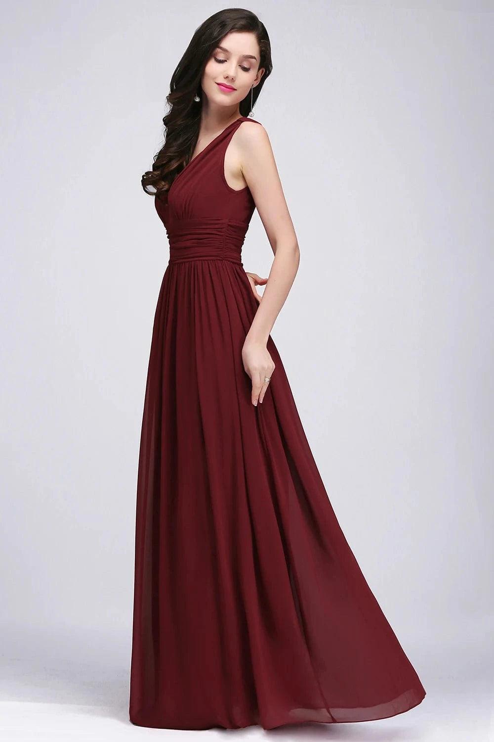 robe demoiselle d'honneur chic longue sans manches couleur rose poudré coupe princesse élégante
