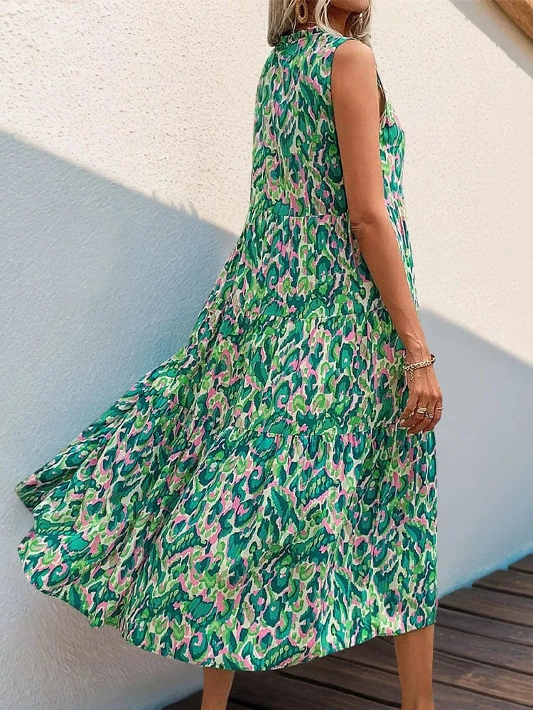 robe bohème fleurie sans manches longue évasée pour été, parfaite pour un mariage ou une occasion chic