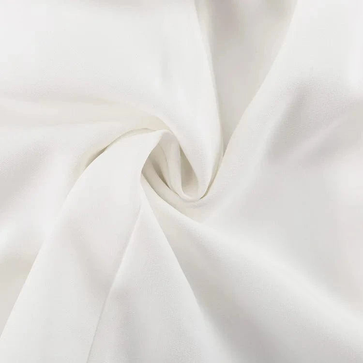 Robe blanche fluide été chic en gaze de coton légère, idéale pour mariage invité ou cérémonie estivale