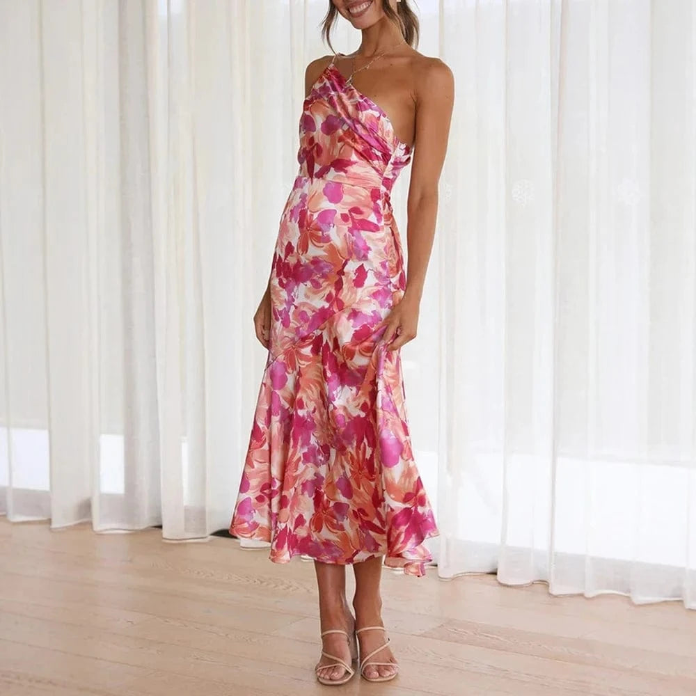 Robe cocktail midi fleurie asymétrique satinée rose orange, idéale soirée été invitée mariage élégante