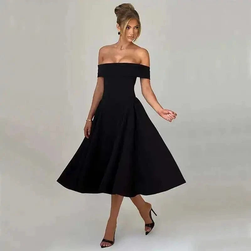 Robe noire soirée chic midi trapèze épaules dénudées élégante pour cocktail ou mariage invitée
