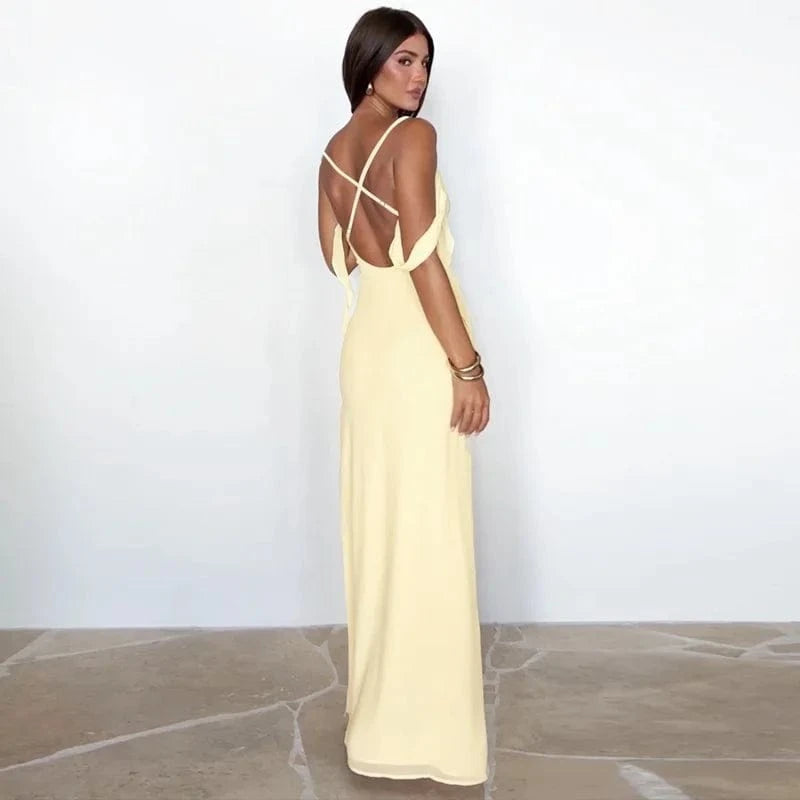 Robe dos nu longue jaune élégante pour soirée estivale, coupe fluide, bretelles croisées, look chic