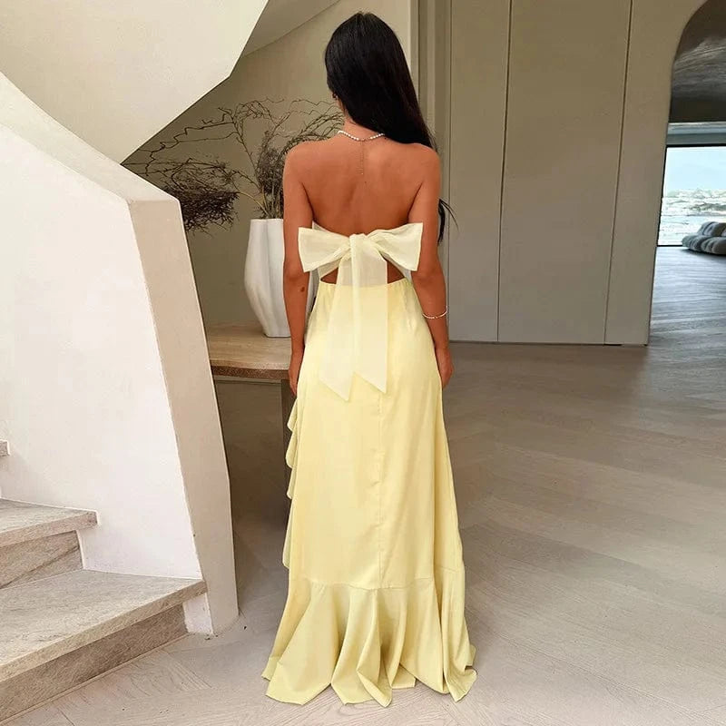 Robe de soirée dos nu longue jaune fluide avec grand nœud élégant, idéale pour mariage invité été chic