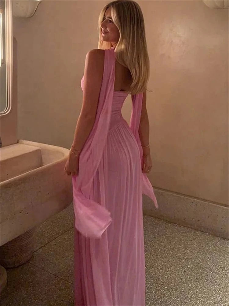 Robe longue rose de soirée chic dos nu fluide pour invitée mariage ou evenement élégant femme