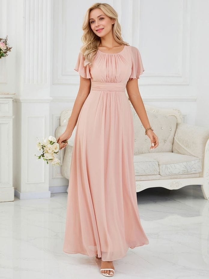 Robe demoiselle d’honneur longue rose poudré fluide, manches courtes, élégante pour mariage chic