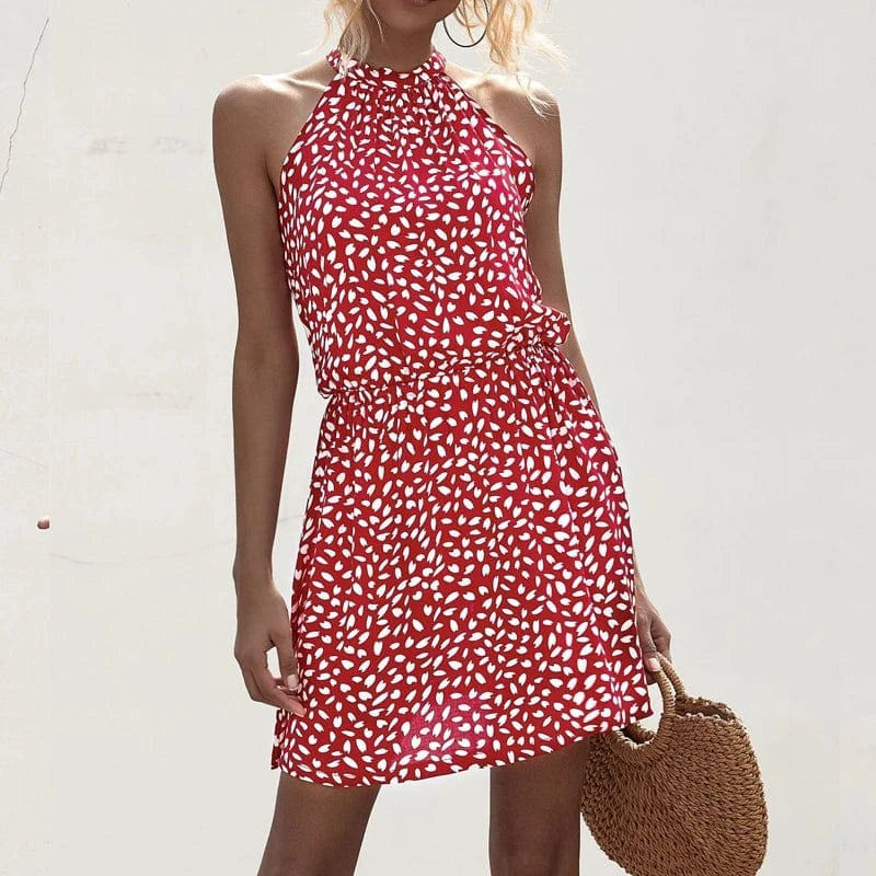 robe été courte à pois col halter trapèze sans manches blanche chic pour plage ou vacances d'été