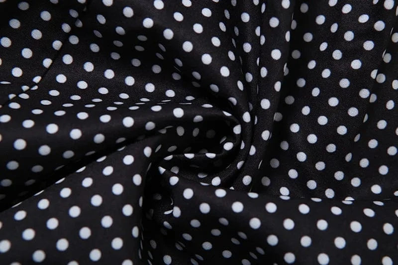 Robe été noire à pois blancs fluide femme longueur midi style vintage chic pour invitation mariage ou cocktail